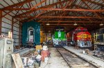 Diesel locomotives inside the barn and a CNW Cab car 